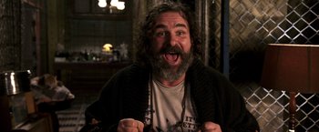 Movie still from “The Darkest Hour” (2011), directed by Chris Gorak – A man with long hair and a beard is making a funny face; Close Up shot, Low angle