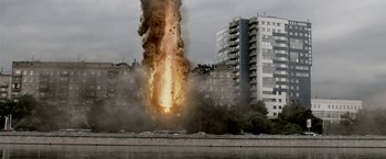 Movie still from “The Darkest Hour” (2011), directed by Chris Gorak – An explosion in a city near a river; Extreme Wide shot, Low angle