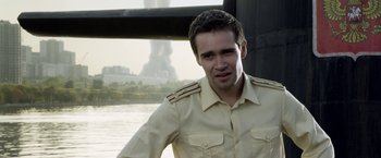 Movie still from “The Darkest Hour” (2011), directed by Chris Gorak – A man wearing a uniform standing next to a body of water; Close Up shot, Over the shoulder angle