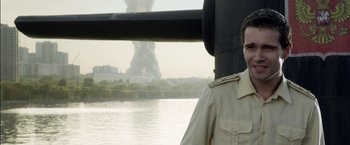 Movie still from “The Darkest Hour” (2011), directed by Chris Gorak – A man in a uniform standing next to a body of water; Close Up shot, Over the shoulder angle