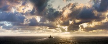Movie still from “The Darkest Hour” (2011), directed by Chris Gorak – A boat in the middle of the ocean under a cloudy sky; Extreme Wide shot, High angle