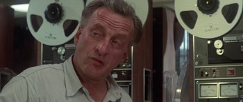 Movie still from “The Day of the Dolphin” (1973), directed by Mike Nichols – An older man is looking into the mirror; Close Up shot, Over the shoulder angle