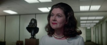 Movie still from “The Day of the Dolphin” (1973), directed by Mike Nichols – A person wearing a white shirt; Close Up shot, Over the shoulder angle