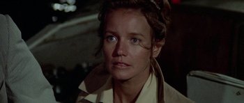 Movie still from “The Day of the Dolphin” (1973), directed by Mike Nichols – A person wearing a trench coat; Close Up shot, Low angle