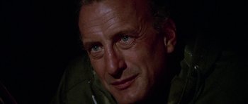 Movie still from “The Day of the Dolphin” (1973), directed by Mike Nichols – A man's face in the dark; Close Up shot, Low angle