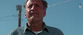 Movie still from “The Day of the Dolphin” (1973), directed by Mike Nichols – An older man looking up into the sky; Close Up shot, Low angle