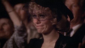 Movie still from “The Day of the Locust” (1975), directed by John Schlesinger – A person wearing a hat; Close Up shot, Over the shoulder angle