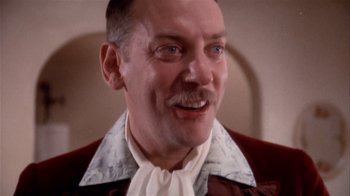 Movie still from “The Day of the Locust” (1975), directed by John Schlesinger – An older man wearing a red jacket and a white shirt; Close Up shot, Low angle