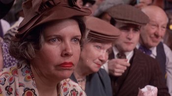 Movie still from “The Day of the Locust” (1975), directed by John Schlesinger – A group of people wearing hats in a crowd; Close Up shot, Low angle