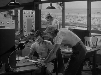 Movie still from “The Day the Earth Stood Still” (1951), directed by Robert Wise – Two men are working in an air traffic control tower; Medium shot, Low angle