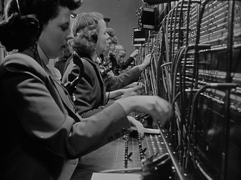Movie still from “The Day the Earth Stood Still” (1951), directed by Robert Wise – A group of women working on a machine; Medium shot, Low angle