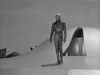 Movie still from “The Day the Earth Stood Still” (1951), directed by Robert Wise – A man in a spacesuit standing on a ramp; Extreme Wide shot, Low angle