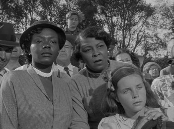 Movie still from “The Day the Earth Stood Still” (1951), directed by Robert Wise – Black and white photograph of a group of people; Close Up shot, Low angle