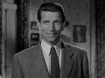 Movie still from “The Day the Earth Stood Still” (1951), directed by Robert Wise – Black and white photograph of a man wearing a suit and tie; Close Up shot, High angle