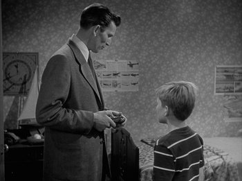 Movie still from “The Day the Earth Stood Still” (1951), directed by Robert Wise – A man and a young boy in a room; Medium shot, Over the shoulder angle