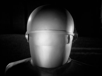 Movie still from “The Day the Earth Stood Still” (1951), directed by Robert Wise – The back of a person's head wearing a helmet; Close Up shot, Low angle