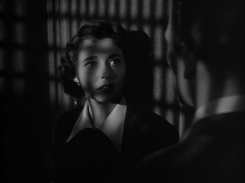 Movie still from “The Day the Earth Stood Still” (1951), directed by Robert Wise – A black - and - white photo of a woman looking at the camera; Close Up shot, High angle