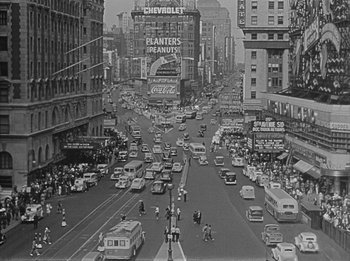 Movie still from “The Day the Earth Stood Still” (1951), directed by Robert Wise – An old black and white photo of a busy city street; Extreme Wide shot, High angle