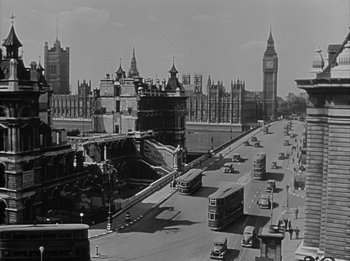 Movie still from “The Day the Earth Stood Still” (1951), directed by Robert Wise – A black and white photo of a city street; Extreme Wide shot, Low angle