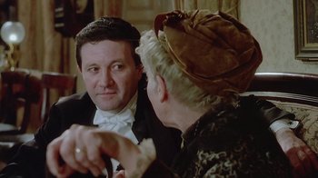 Movie still from “The Dead” (1987), directed by John Huston – A man and a woman talking to each other; Close Up shot, Over the shoulder angle