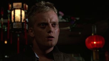 Movie still from “The Dead Pool” (1988), directed by Buddy Van Horn – A person wearing a brown jacket; Close Up shot, Low angle