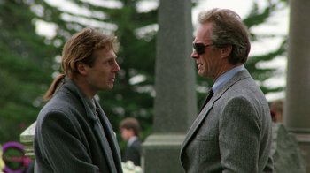 Movie still from “The Dead Pool” (1988), directed by Buddy Van Horn – A man and a man talking to each other; Medium shot, Low angle