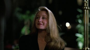 Movie still from “The Dead Pool” (1988), directed by Buddy Van Horn – A woman with long blonde hair smiling for the camera; Close Up shot, Low angle