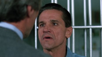 Movie still from “The Dead Pool” (1988), directed by Buddy Van Horn – A person talking to another person; Close Up shot, Over the shoulder angle