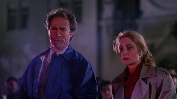 Movie still from “The Dead Pool” (1988), directed by Buddy Van Horn – A man and a woman standing next to each other; Close Up shot, Low angle