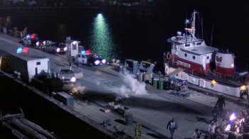 Movie still from “The Dead Pool” (1988), directed by Buddy Van Horn – A boat is on fire on the water; Extreme Wide shot, High angle