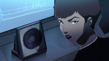 Movie still from “The Death and Return of Superman” (2019), directed by Sam Liu – An animated picture of a woman and a speaker; Close Up shot, Over the shoulder angle