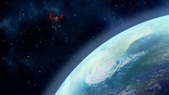 Movie still from “The Death and Return of Superman” (2019), directed by Sam Liu – A man flying through the air over a planet; Extreme Wide shot, Low angle