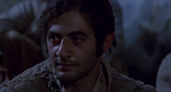 Movie still from “The Decameron” (1971), directed by Pier Paolo Pasolini – A person wearing a jacket; Close Up shot, Low angle