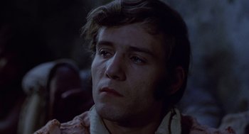 Movie still from “The Decameron” (1971), directed by Pier Paolo Pasolini – A person wearing a jacket; Close Up shot, Low angle