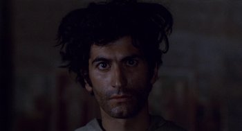 Movie still from “The Decameron” (1971), directed by Pier Paolo Pasolini – A person with a beard; Close Up shot, Low angle