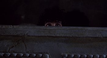 Movie still from “The Decameron” (1971), directed by Pier Paolo Pasolini – A man with a curly hair looking out of a window; Close Up shot, Low angle