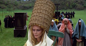 Movie still from “The Decameron” (1971), directed by Pier Paolo Pasolini – A woman with a basket on her head; Close Up shot, Low angle