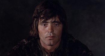 Movie still from “The Decameron” (1971), directed by Pier Paolo Pasolini – A person wearing a fur coat; Close Up shot, Low angle