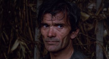 Movie still from “The Decameron” (1971), directed by Pier Paolo Pasolini – A person wearing a shirt; Close Up shot, High angle