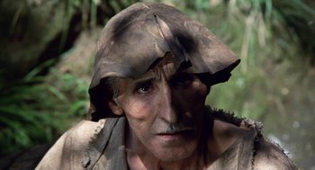Movie still from “The Decameron” (1971), directed by Pier Paolo Pasolini – An old man wearing a hat and a beard; Close Up shot, High angle