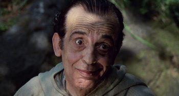 Movie still from “The Decameron” (1971), directed by Pier Paolo Pasolini – An older man with a surprised look on his face; Close Up shot, High angle