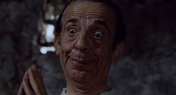 Movie still from “The Decameron” (1971), directed by Pier Paolo Pasolini – An older man with a surprised look on his face; Close Up shot, Low angle