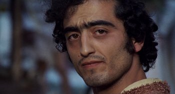 Movie still from “The Decameron” (1971), directed by Pier Paolo Pasolini – A man's face with a beard; Close Up shot, Low angle