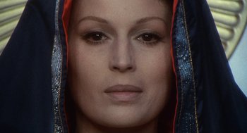 Movie still from “The Decameron” (1971), directed by Pier Paolo Pasolini – A woman's face wearing a hood; Close Up shot, Overhead angle