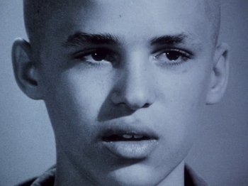 Movie still from “The Decline of Western Civilization” (1981), directed by Penelope Spheeris – A young man's face in black and white; Close Up shot, High angle