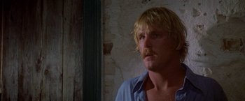 Movie still from “The Deep” (1977), directed by Peter Yates – A person with a mustache; Close Up shot, Low angle
