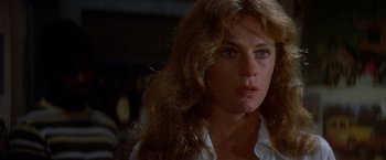 Movie still from “The Deep” (1977), directed by Peter Yates – A person with long blonde hair; Close Up shot, Over the shoulder angle