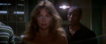 Movie still from “The Deep” (1977), directed by Peter Yates – A person wearing a bra; Close Up shot, Over the shoulder angle