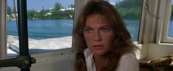 Movie still from “The Deep” (1977), directed by Peter Yates – A person with long hair; Close Up shot, Over the shoulder angle
