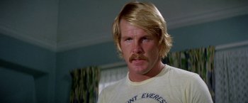 Movie still from “The Deep” (1977), directed by Peter Yates – A person with a mustache; Close Up shot, Low angle